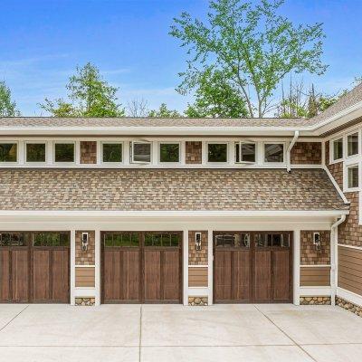 Three car garage with gym,  sports lounge, and craft room above